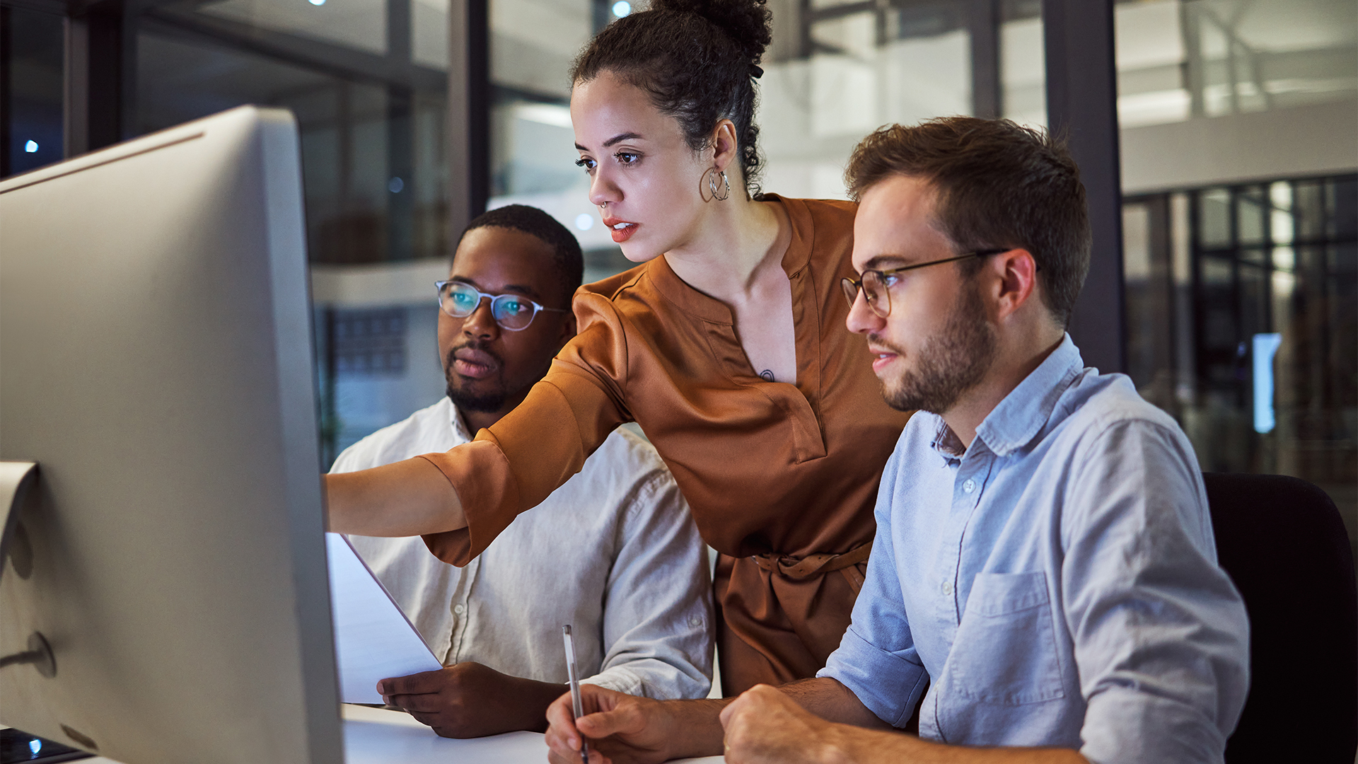 Learning, computer and training business interns in night office with manager, boss and leadership help