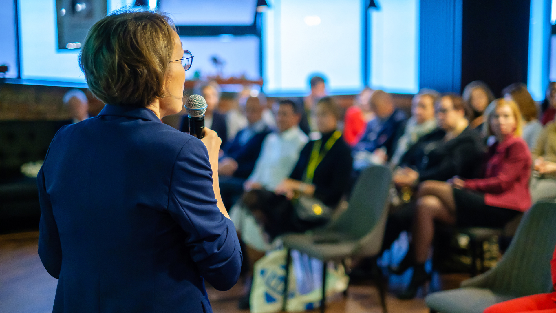 Female presenter speaks to audiences